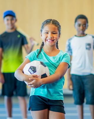 Girl holding soccer ball