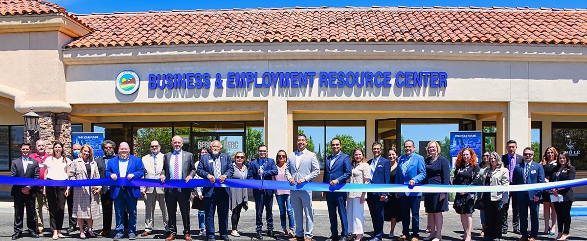 Ribbon cutting in front of the new Business & Employment Center.