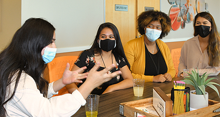 Group of teens talking at at table